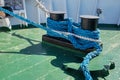 Ship is moored to the berth using a nylon rope tied to a bollard Royalty Free Stock Photo