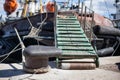 The ship is moored to a dock ladder rope chain Royalty Free Stock Photo