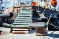 The ship is moored to a dock ladder rope chain Royalty Free Stock Photo