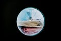 Ship moored to port seen through from inside the porthole of a ship Royalty Free Stock Photo