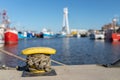 Ship mooring rope moored on the bollard. Moored boat in the port Royalty Free Stock Photo