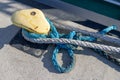 Ship mooring rope moored on the bollard. Moored boat in the port Royalty Free Stock Photo