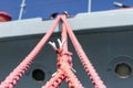 Ship mooring rope on the port wharf. Harbor bollard for large na Royalty Free Stock Photo