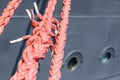 Ship mooring rope on the port wharf. Harbor bollard for large na Royalty Free Stock Photo