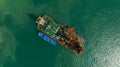 ship oil drilling rig in green sea aerial top view