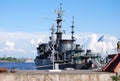 The ship `Periscope` stands in the Military Harbor on the pier.