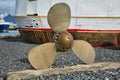 Ship propeller on shore Royalty Free Stock Photo
