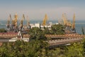 Ship-repair yard. Industrial zone of sea cargo port with grain dryers, containers, cranes and storehouses photo