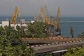 Ship-repair yard. Industrial zone of sea cargo port with grain dryers, containers, cranes and storehouses photo Royalty Free Stock Photo