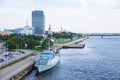 Ship at River Daugava, port and buildings. Urban city view. Water and nature.