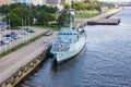 Ship at River Daugava, port and buildings. Urban city view. Water and nature.