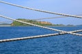 Ship rope against blue water sea texture background Royalty Free Stock Photo