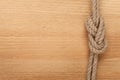 Ship rope knot on wooden background Royalty Free Stock Photo