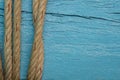 Ship rope or marine rope on blue wooden texture background. Royalty Free Stock Photo