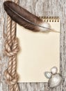 Ship rope, shells, feather, notebook and old wood