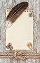 Ship rope, shells, feather, notebook and wood background