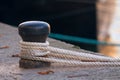 Ship rope tied to a harbor Royalty Free Stock Photo