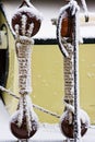 Ship ropes covered with snow in winter