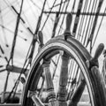 Ship`s Bell and wheel the old sailboat, close-up