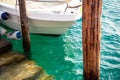 Ship`s bow and aquamarine water, lake Garda. Boat and sea, detail. Sailing vessel drops anchor Royalty Free Stock Photo