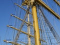 The ship`s rope hangs on the mast of a sailing ship.  A Bay of nylon rope on the deck of a sailboat. Royalty Free Stock Photo