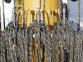 The ship`s rope hangs on the mast of a sailing ship.  A Bay of nylon rope on the deck of a sailboat. Royalty Free Stock Photo