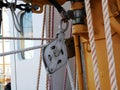 The ship`s rope hangs on the mast of a sailing ship.  A Bay of nylon rope on the deck of a sailboat. Royalty Free Stock Photo