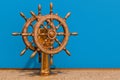 Ship`s wheel or boat`s wheel in room on the wooden floor, 3D rendering