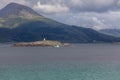 Ship to visit fjords in Norway. A mystical fjord with dark clouds in Norway with mountains and fog hanging over the water Royalty Free Stock Photo