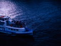 ship sailing on a dark river during calm evening summer Royalty Free Stock Photo