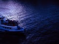 ship sailing on a dark river during calm evening summer Royalty Free Stock Photo