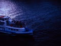 ship sailing on a dark river during calm evening summer Royalty Free Stock Photo