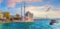 Ship is sailing near the Bosphorus bridge and Ortakoy Mosque, Istanbul, Turkey Royalty Free Stock Photo