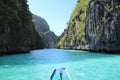 Ship sailing through a sea of blue and mountains Royalty Free Stock Photo