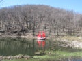 Ship with scarlet sails on the lake spring forest