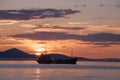 The ship in the sea against the backdrop of the rising sun. Royalty Free Stock Photo