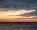 Ship in the sea against the sky and clouds