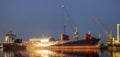 Ship in the sea port,port cranes unloading containers-panorama