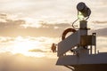 Ship searchlight and lifeline in evening sunlight... Royalty Free Stock Photo