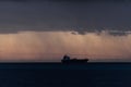 A ship is seen cruising under a storm
