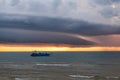 A ship is seen cruising under a storm