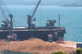 Ship Silver Pegasus in the process of unloading wood chips in the port of Setubal, Portugal Royalty Free Stock Photo