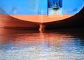 Ship stern with reflection in harbor water