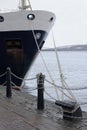 Ship anchor rope line tied knot at port dock Royalty Free Stock Photo