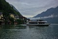 A ship with tourists on the picturesque Lake Hallstatter near the village of Hallstatt