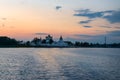 Ship trail on the water in front of the monastery Royalty Free Stock Photo