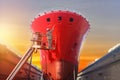 Ship under repair in floating dry dock worker standing in sherry picker car. Royalty Free Stock Photo