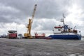 Ship unloading grain on truck