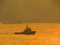 a ship on the water at sunrise, hong kong