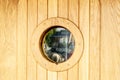 Ship window or porthole on wooden wall Royalty Free Stock Photo